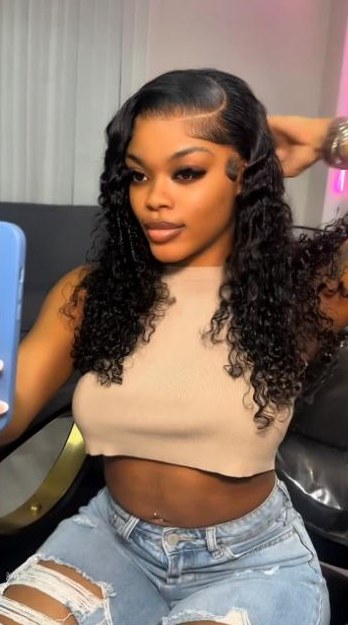 Curly install with a side part and laid edges